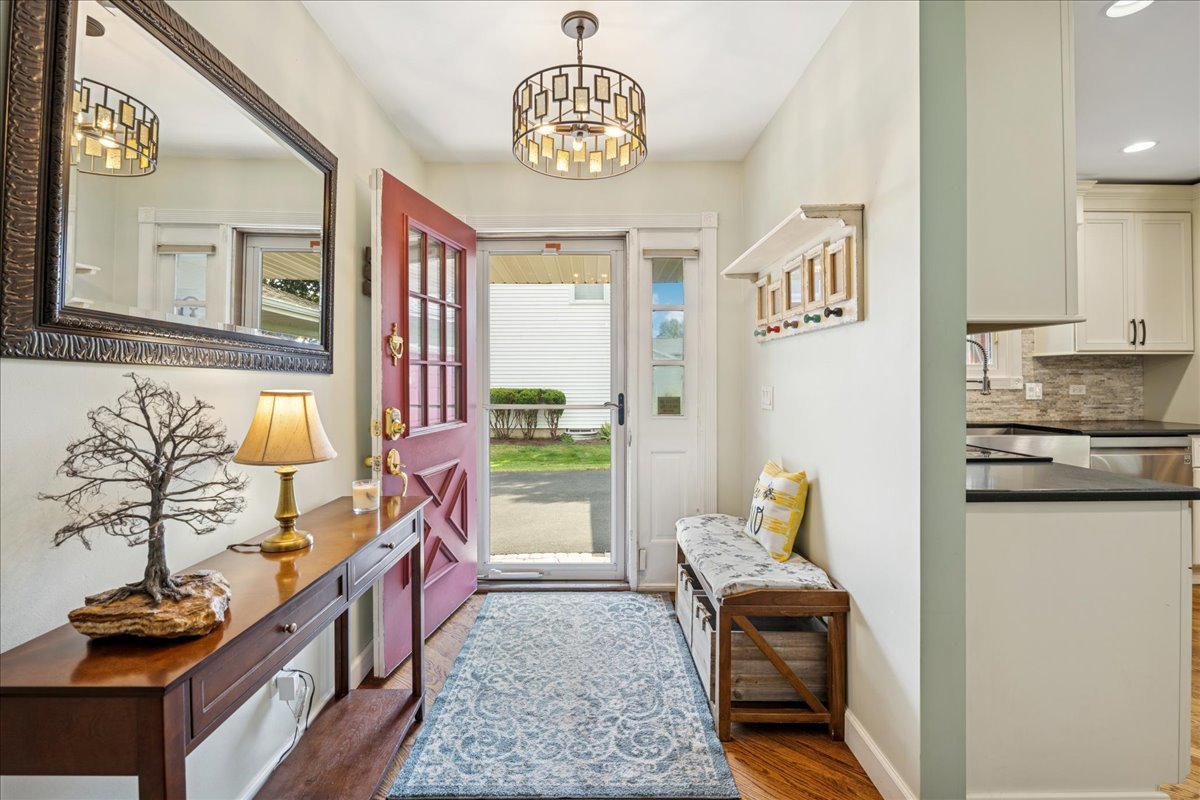 305 Pearl Street Cary, IL 60013 - Photo 2 of 25 a living room with furniture and a chandelier