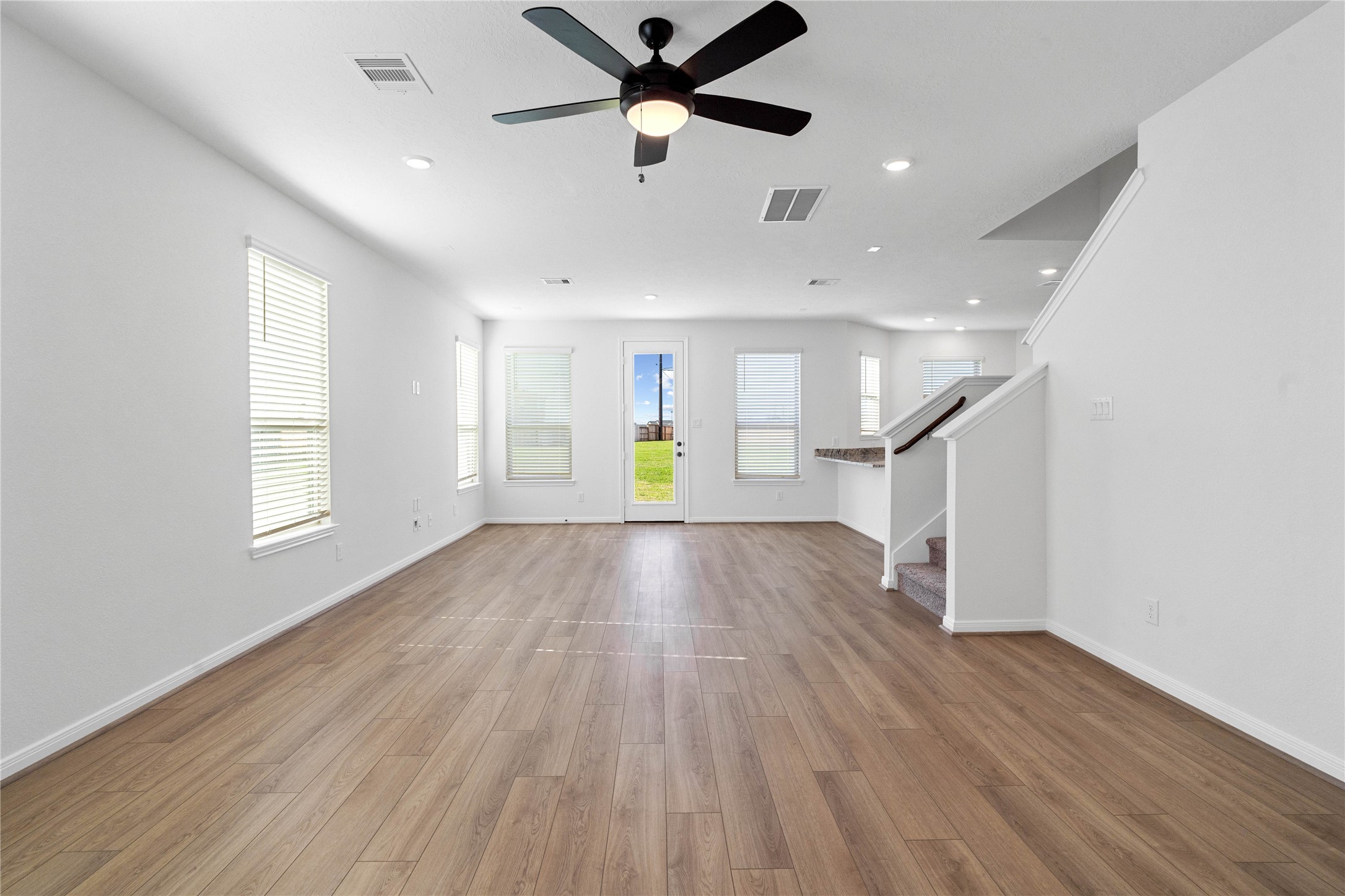 6406 Canby Court Rosharon, TX 77583 - Photo 5 of 28 Beautiful open-concept layout effortlessly uniting the living, dining, and kitchen spaces—ideal for everyday comfort and entertaining guests!