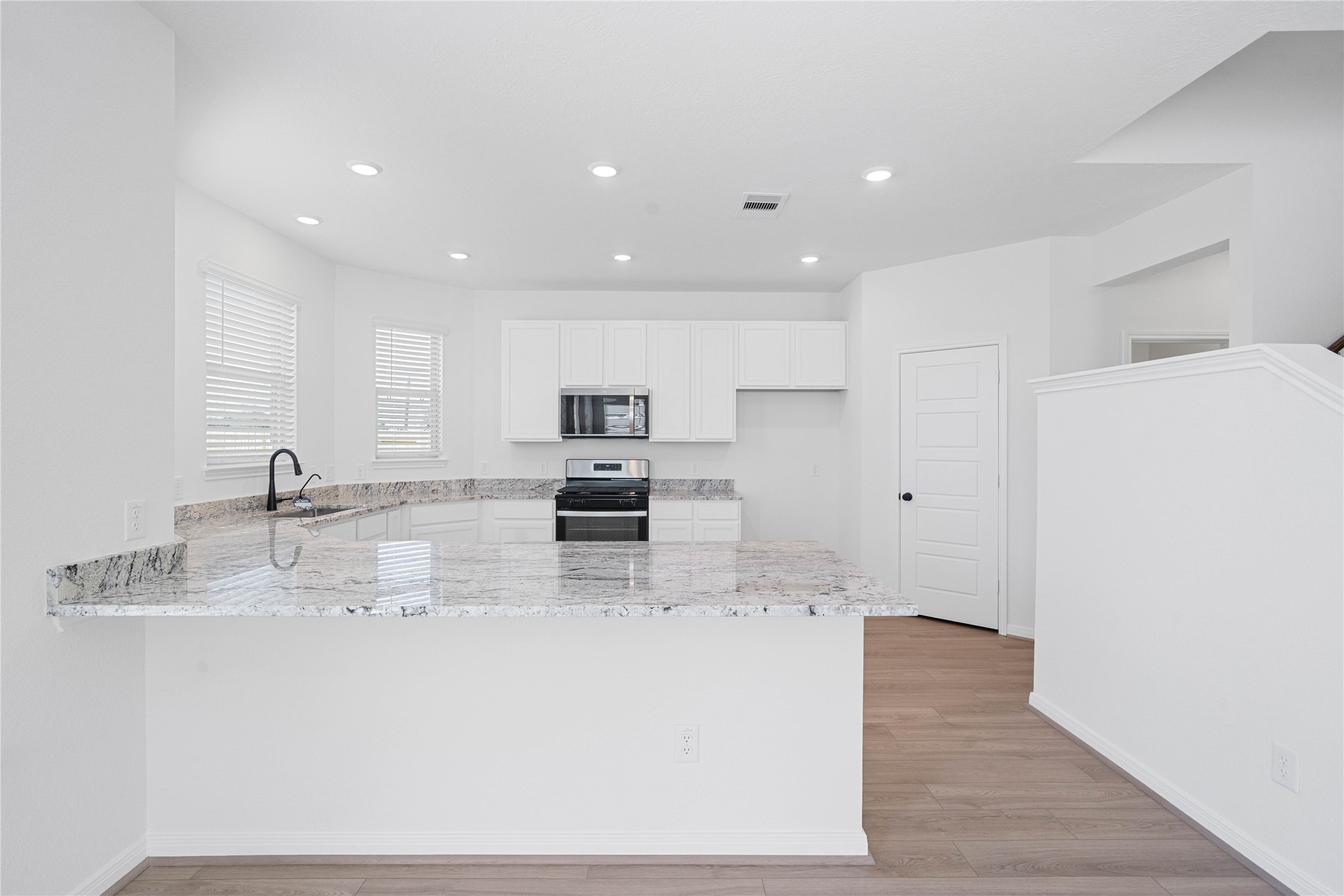 6406 Canby Court Rosharon, TX 77583 - Photo 7 of 28 This spacious kitchen has it all—ample storage, generous counter space, and a layout that truly makes it the heart of the home.