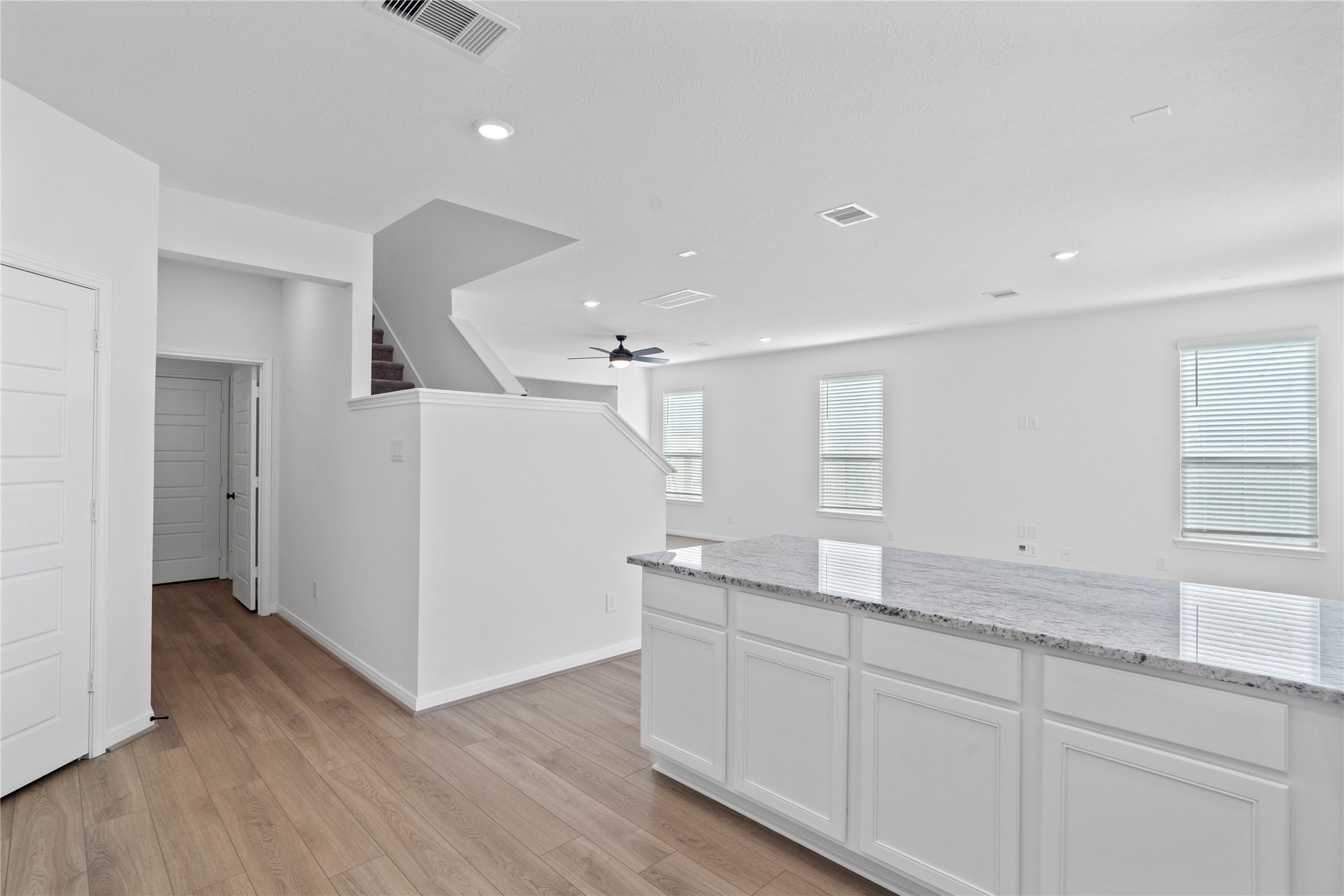 6406 Canby Court Rosharon, TX 77583 - Photo 9 of 28 Additional view from kitchen looking towards hallway to laundry room, powder room, and staircase to second floor.