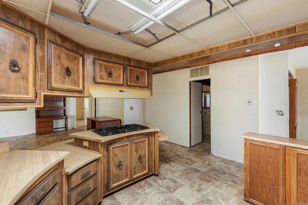 1175 La Moree Road, Unit 10 San Marcos, CA 92078 - Photo 15 of 40 a kitchen that has a cabinets and a stove
