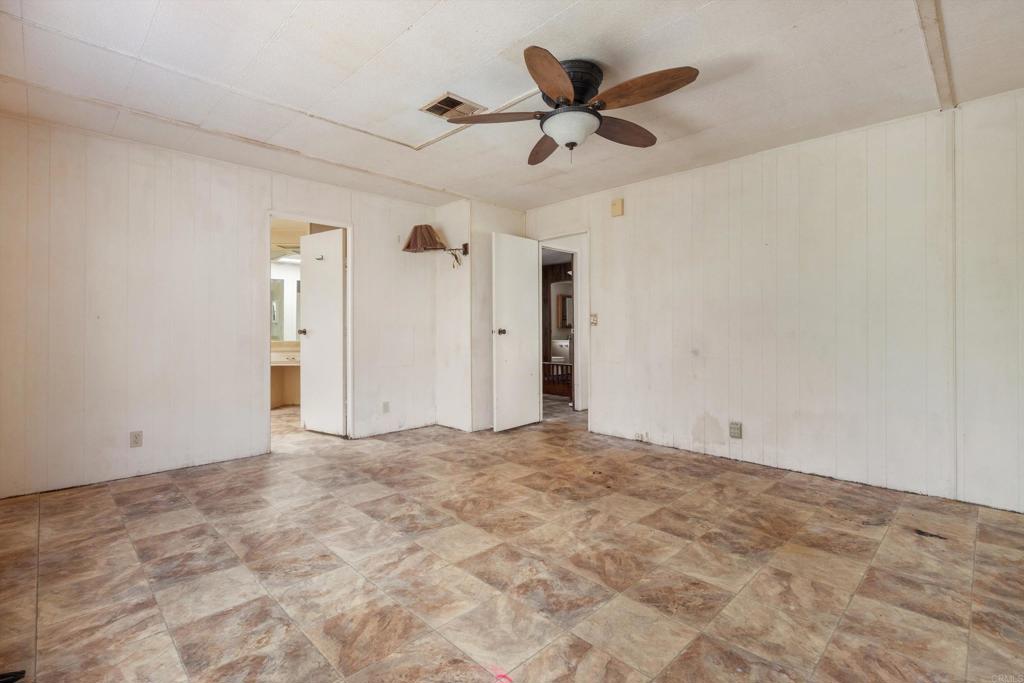 1175 La Moree Road, Unit 10 San Marcos, CA 92078 - Photo 21 of 40 a view of a livingroom with a ceiling fan and window