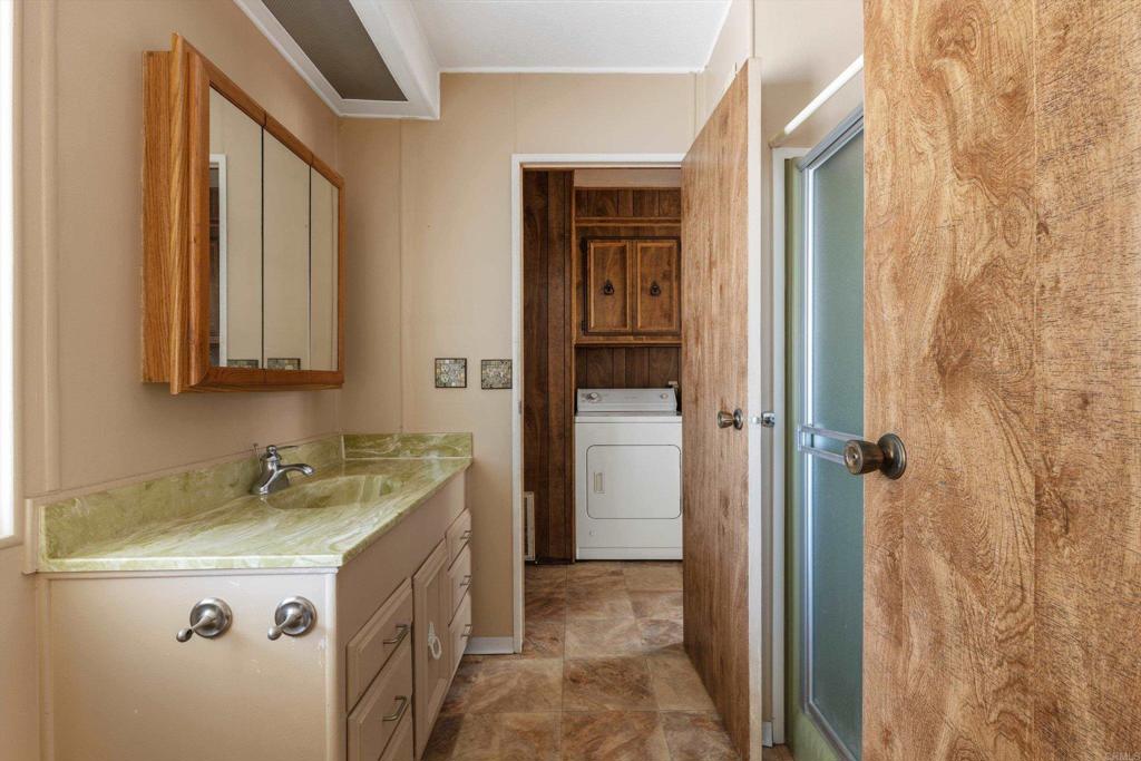 1175 La Moree Road, Unit 10 San Marcos, CA 92078 - Photo 27 of 40 a utility room with a sink dryer and washer