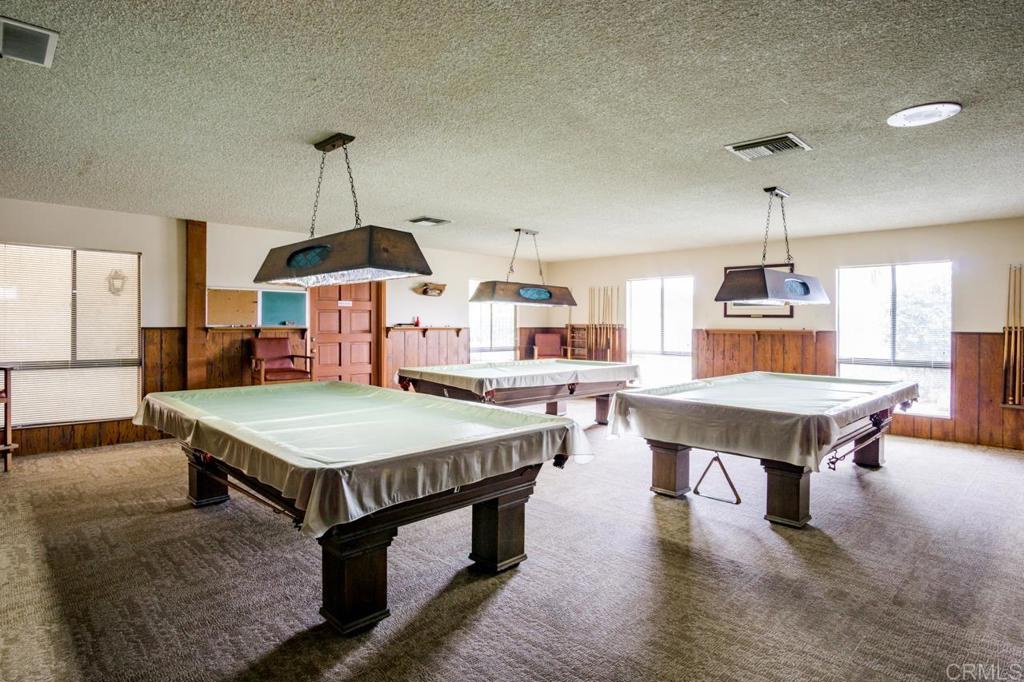 1175 La Moree Road, Unit 10 San Marcos, CA 92078 - Photo 39 of 40 a room with furniture and wooden floor