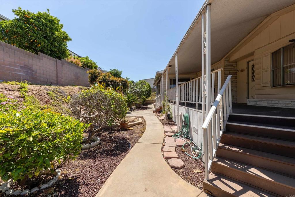 1175 La Moree Road, Unit 10 San Marcos, CA 92078 - Photo 4 of 40 a view of path with wooden fence and plants