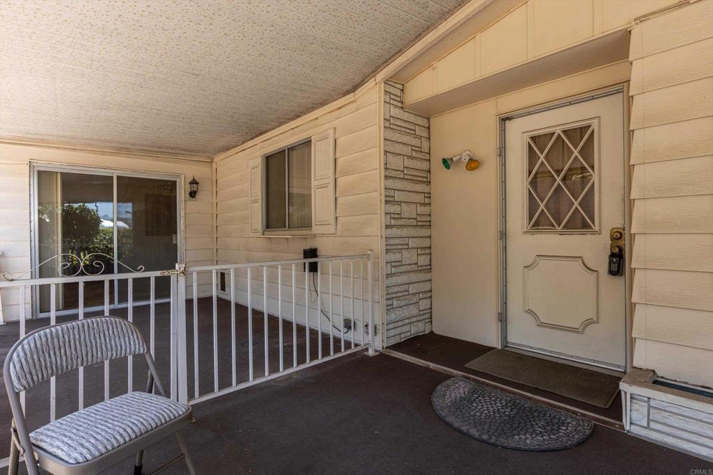 1175 La Moree Road, Unit 10 San Marcos, CA 92078 - Photo 7 of 40 a view of a door and chair in a room