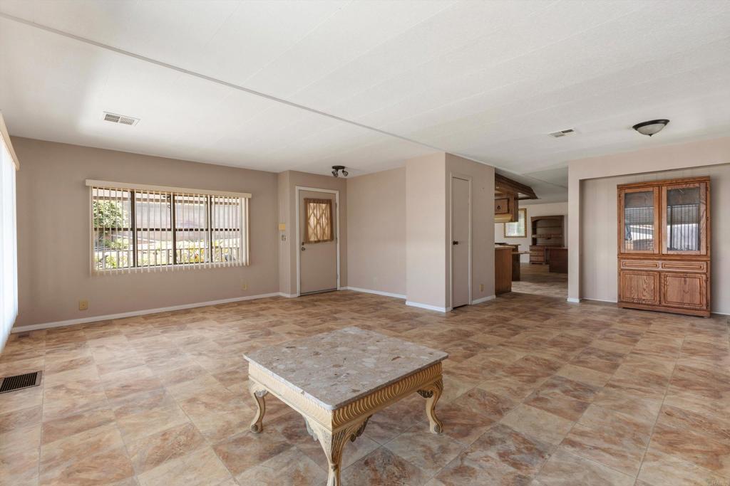 1175 La Moree Road, Unit 10 San Marcos, CA 92078 - Photo 10 of 40 an empty room with windows and cabinet