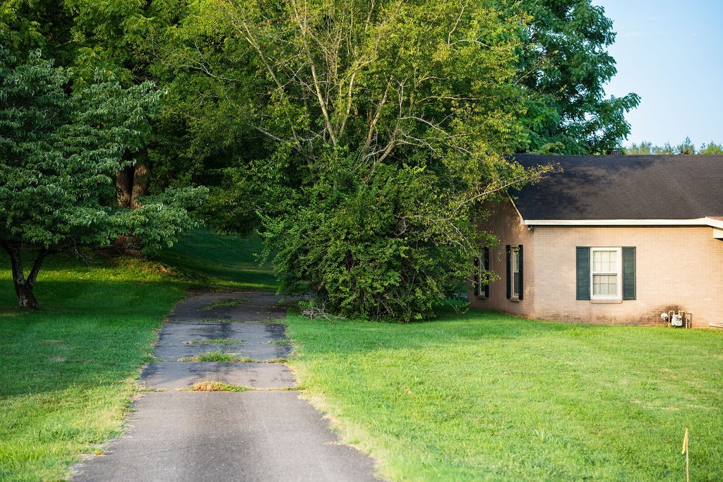 4115 Murfreesboro Road Franklin, TN 37067 - Photo 16 of 31 a front view of a house with garden