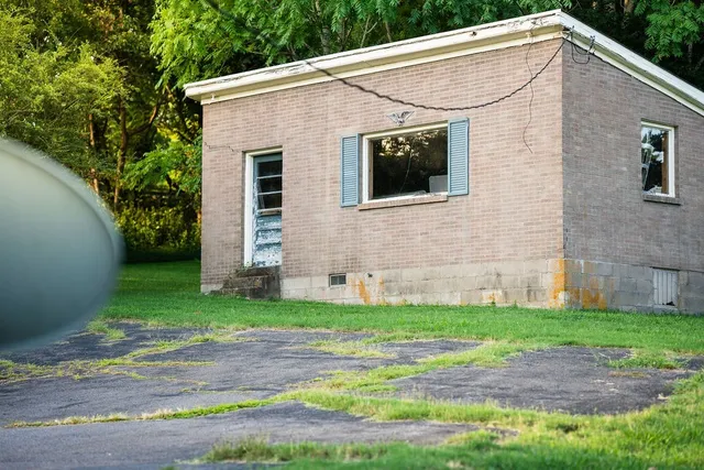 a brick house with a yard