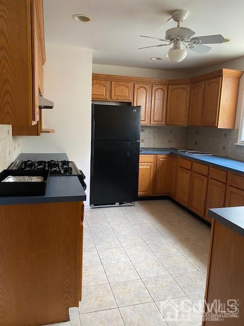 78 Norman Road Newark, NJ 07106 - Photo 9 of 9 a kitchen with granite countertop a refrigerator a sink and dishwasher