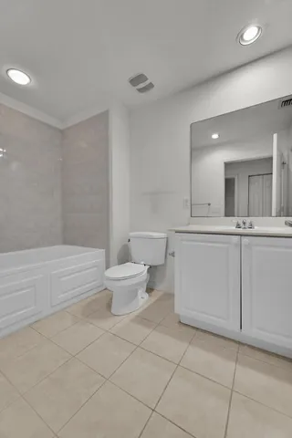 a bathroom with a sink a toilet and a bathtub