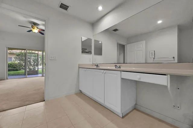 a kitchen with stainless steel appliances granite countertop a sink and a cabinets