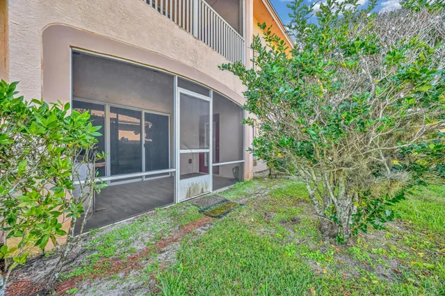 a backyard of a house with plants and garden