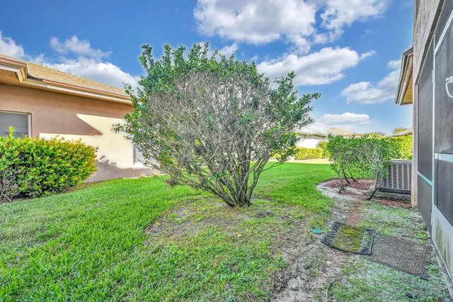 a view of a garden with a building