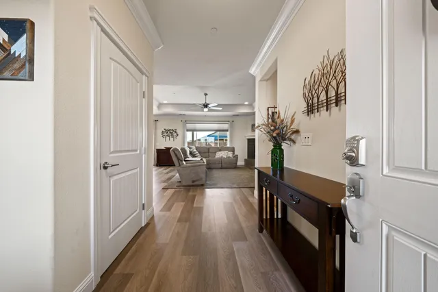 a view of a hallway view with wooden floor and staircase