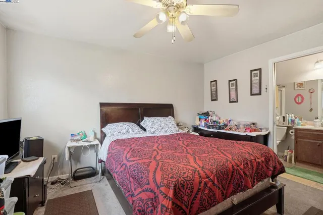 a view of a backyard with wooden fence