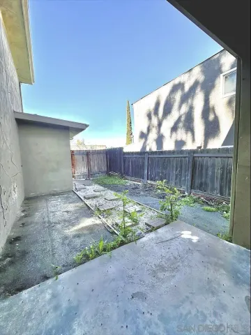 a view of backyard with green space