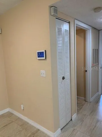 a view of a hallway with closet area