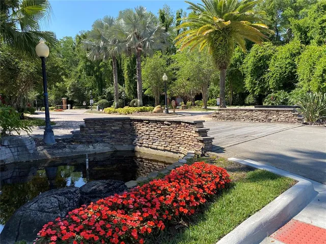 a view of a house with potted plants