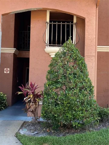 a view of house with outdoor space and swimming pool