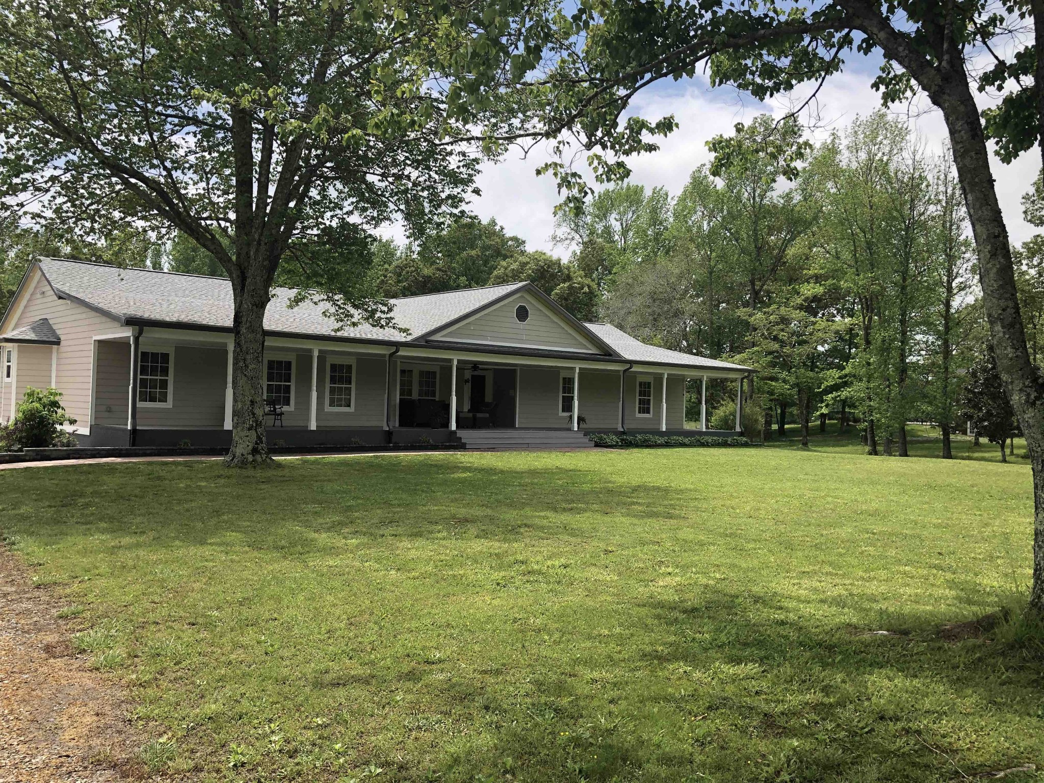 580 Pruett Road Dickson, TN 37055 - Photo 1 of 46 a front view of a house with a garden