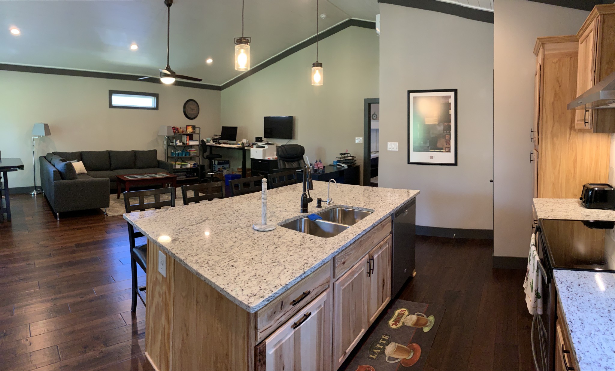 580 Pruett Road Dickson, TN 37055 - Photo 23 of 46 a kitchen with stainless steel appliances kitchen island granite countertop a table chairs in it and wooden floors