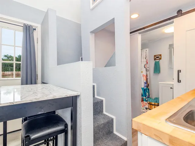 a room with a table and chairs