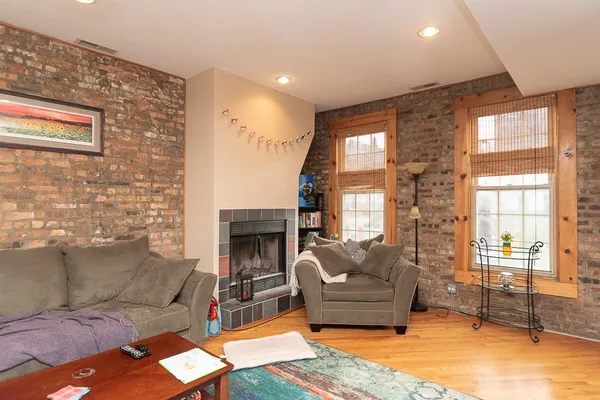 a living room with furniture and a fireplace