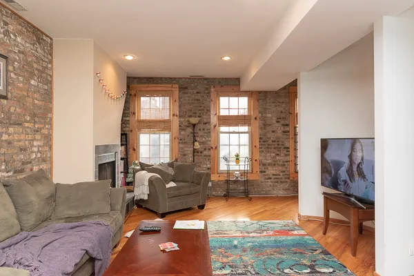 a living room with furniture and a rug