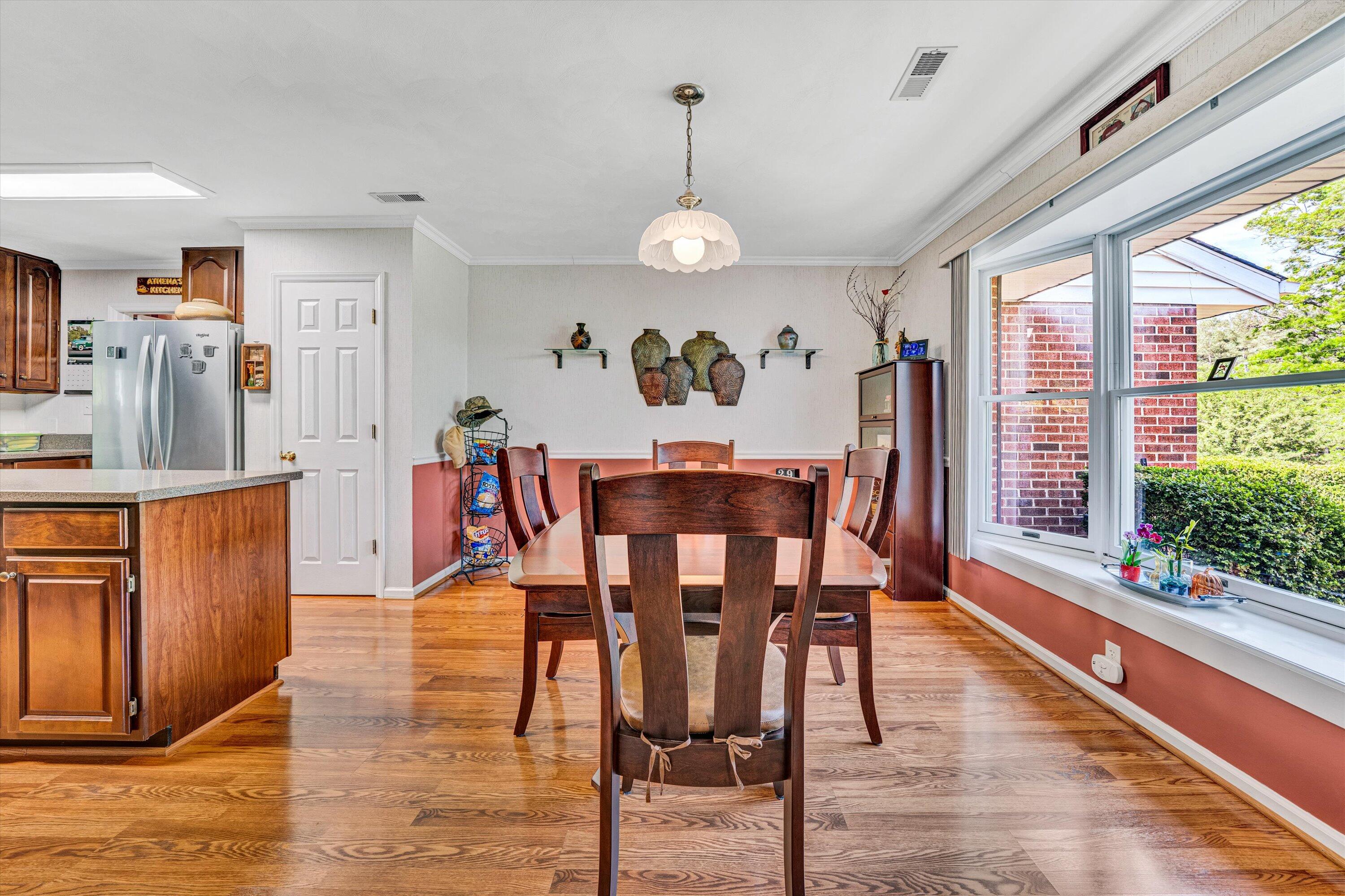 1033 Annie Bell Road Blue Ridge, VA 24064 - Photo 18 of 46 a view of a dining room with furniture window and wooden floor