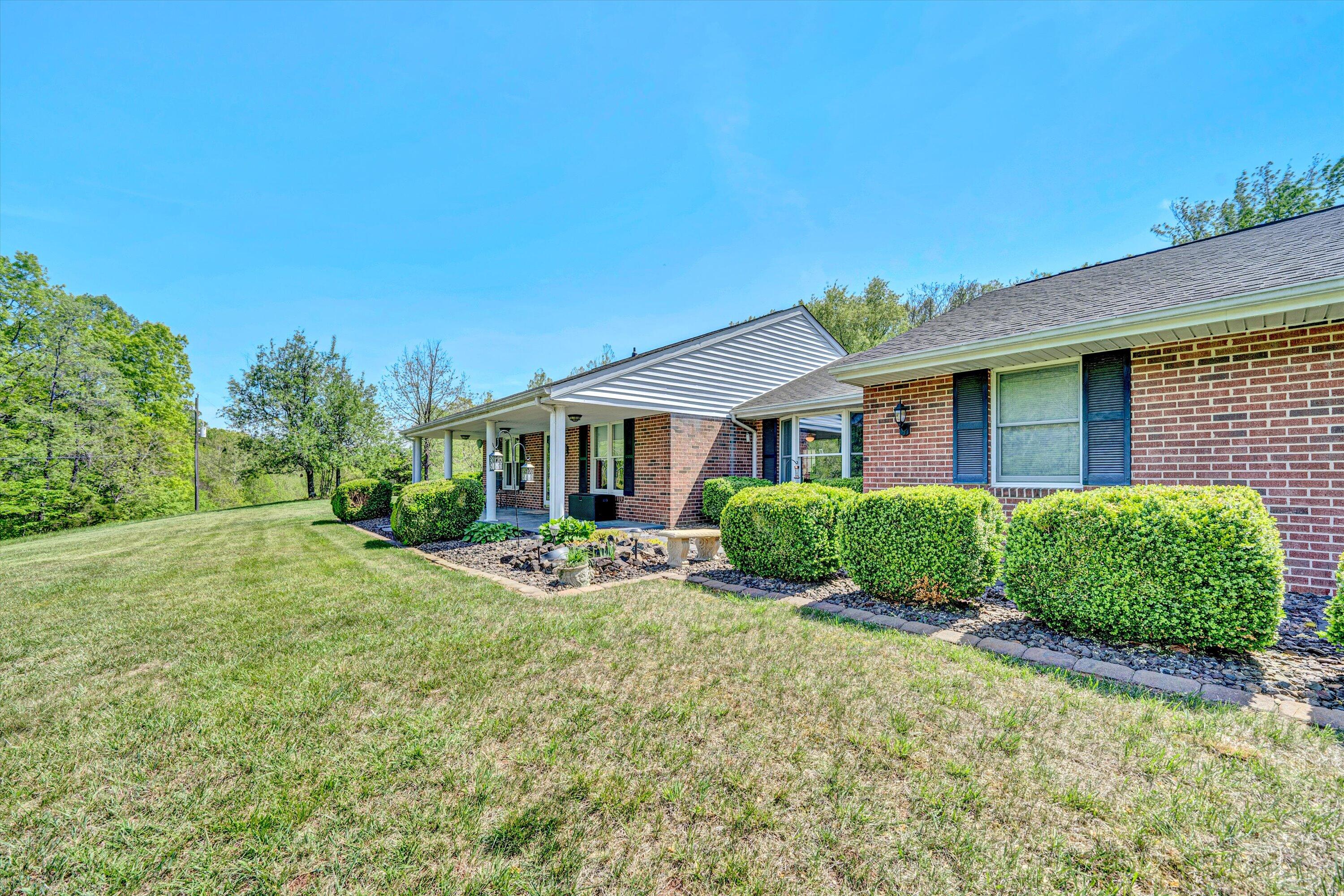 1033 Annie Bell Road Blue Ridge, VA 24064 - Photo 2 of 46 a front view of a house with a yard