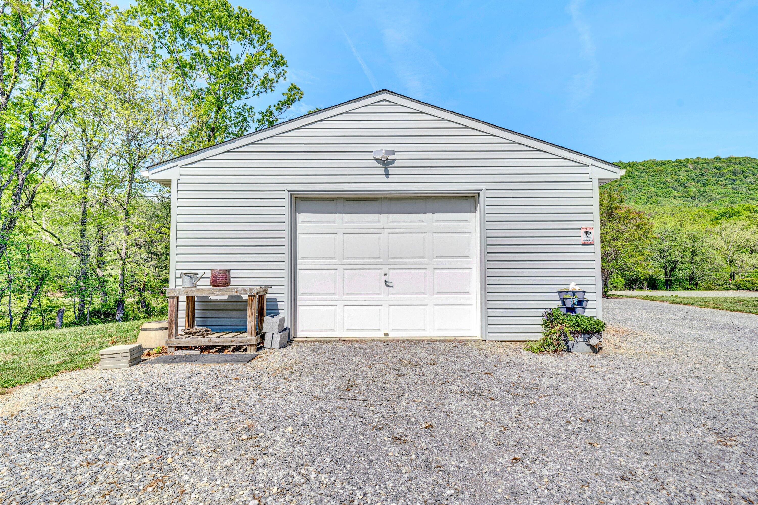 1033 Annie Bell Road Blue Ridge, VA 24064 - Photo 34 of 46 a backyard of a house with table and chairs