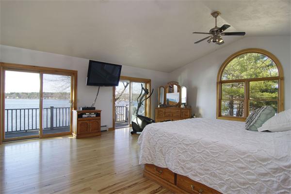 170 Red Gable Road East Brookfield, MA 01515 - Photo 9 of 30 a large bedroom with a bed and a large window