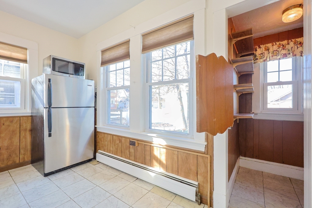55 Glenellen Road Boston, MA 02132 - Photo 13 of 41 a view of kitchen with furniture and large window