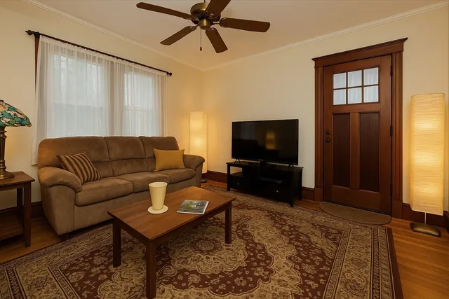a living room with furniture and a flat screen tv