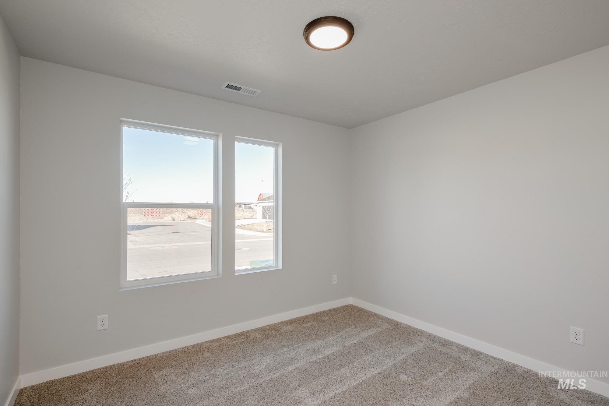 3290 South Maple Rnch Way Nampa, ID 83686 - Photo 11 of 20 Unfurnished room featuring baseboards and carpet floors