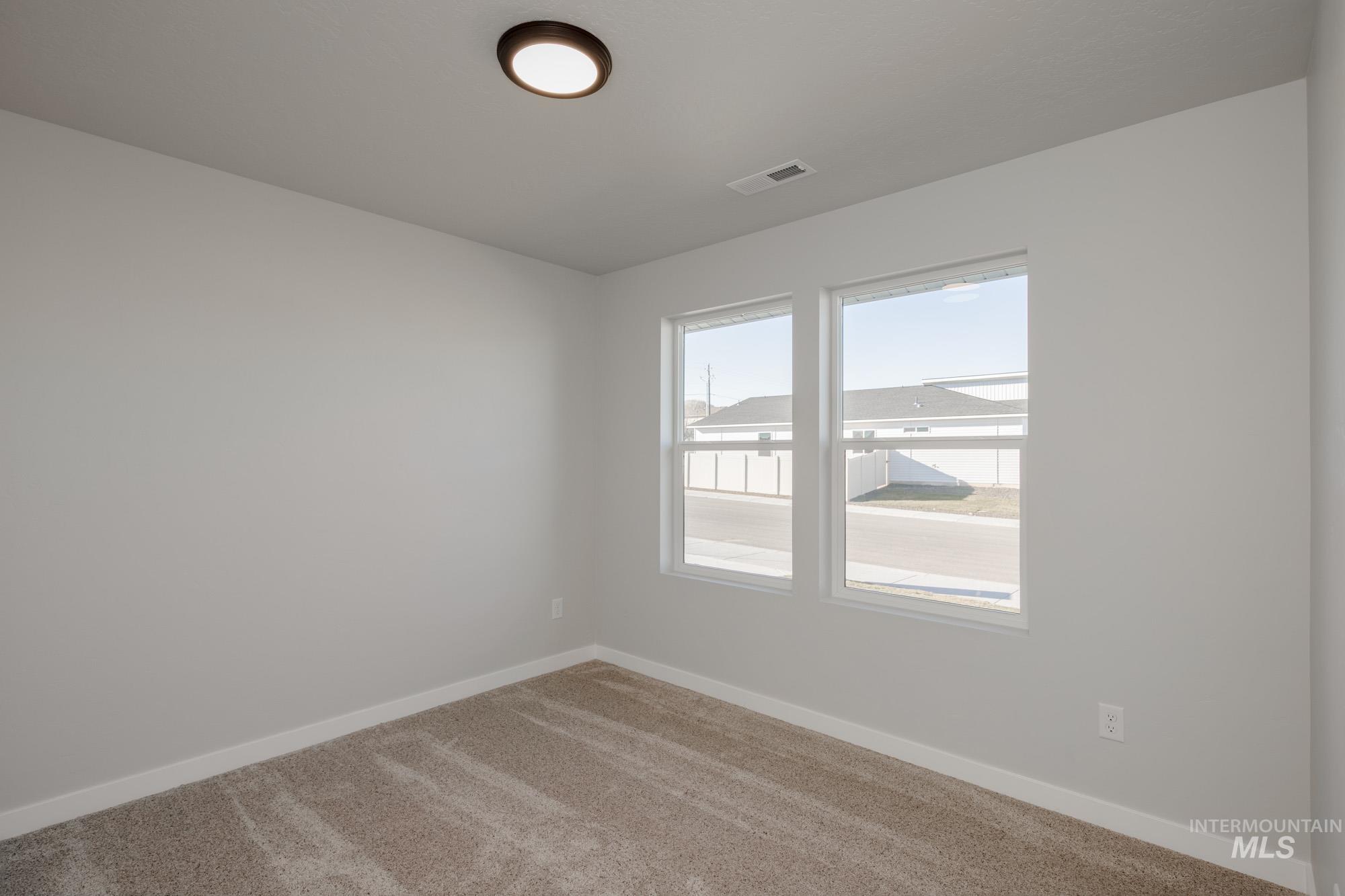 3290 South Maple Rnch Way Nampa, ID 83686 - Photo 12 of 20 Carpeted empty room with baseboards