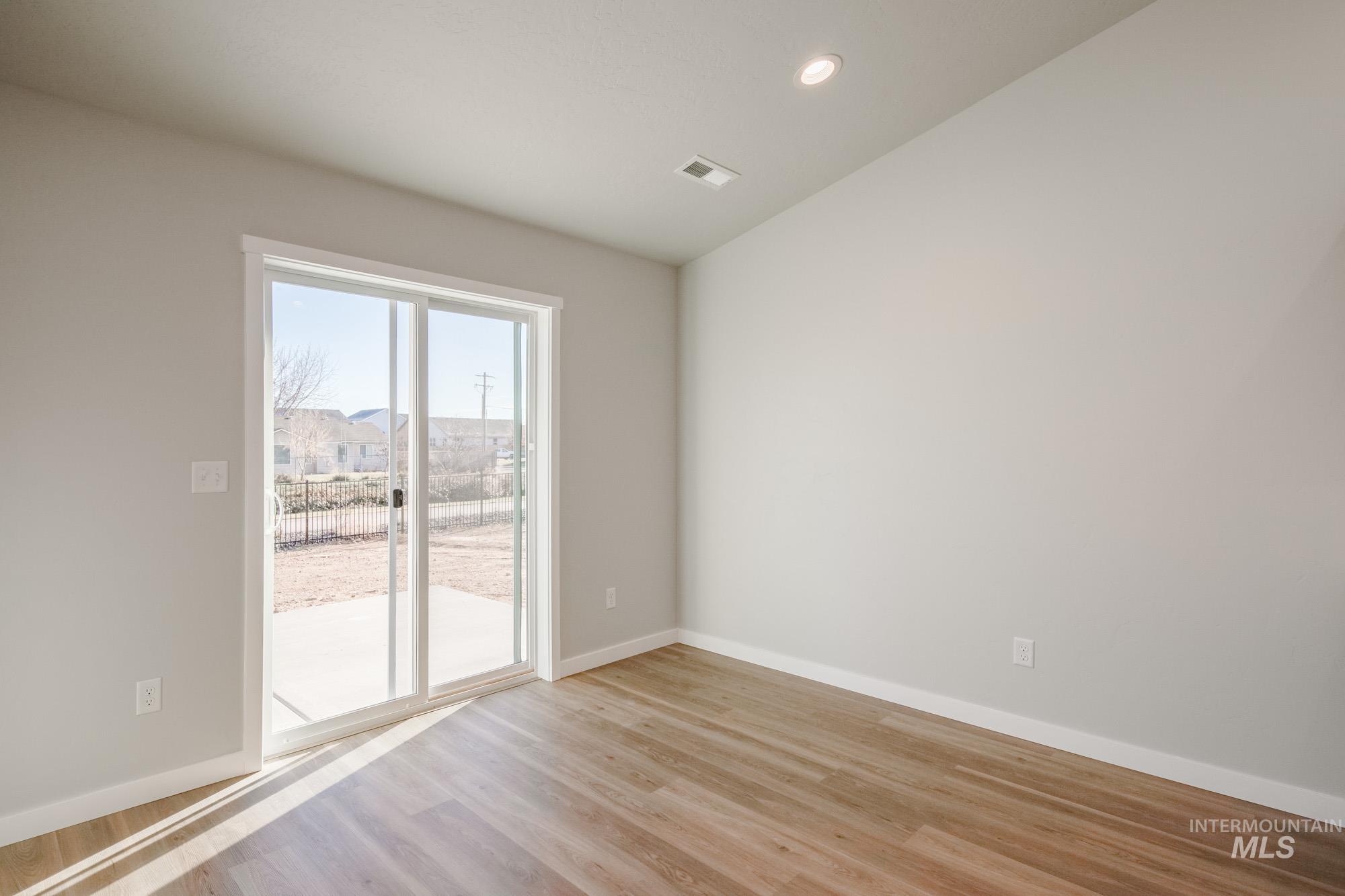 3290 South Maple Rnch Way Nampa, ID 83686 - Photo 18 of 20 Unfurnished room with light wood-type flooring and recessed lighting