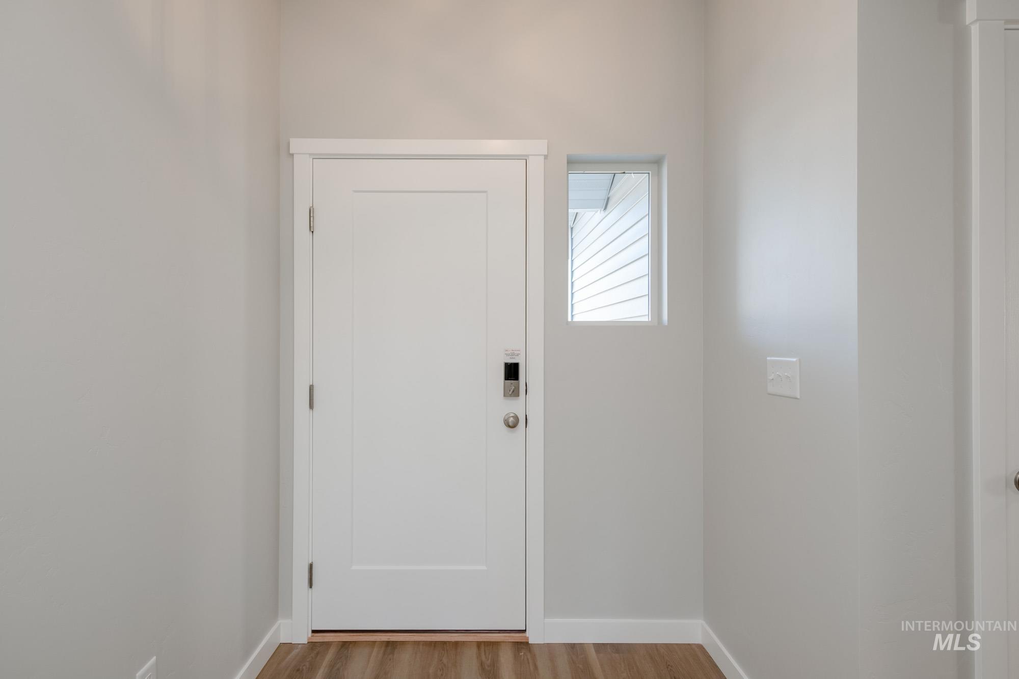 3290 South Maple Rnch Way Nampa, ID 83686 - Photo 3 of 20 Entrance foyer with light wood-style floors and baseboards