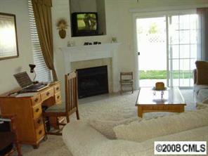 723 Shellstone Place, Unit 723 Fort Mill, SC 29708 - Photo 3 of 7 a living room with furniture and a fireplace