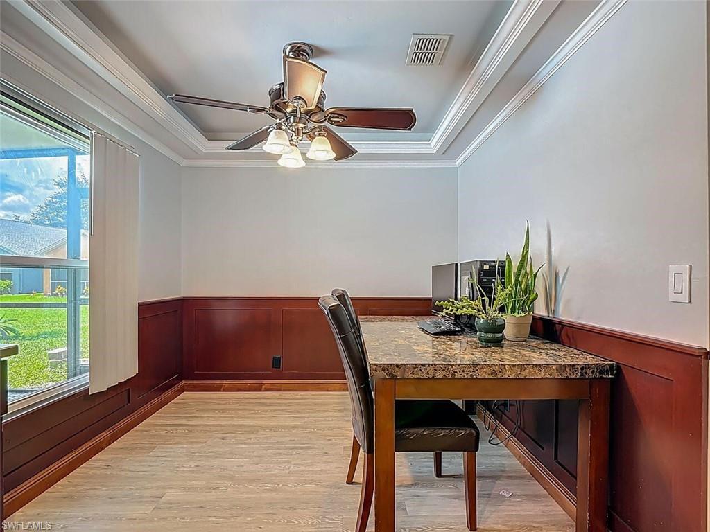 14991 Savannah Drive Naples, FL 34119 - Photo 26 of 50 a view of a dining room with furniture window and wooden floor