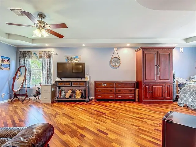 a view of a livingroom with furniture and a flat screen tv