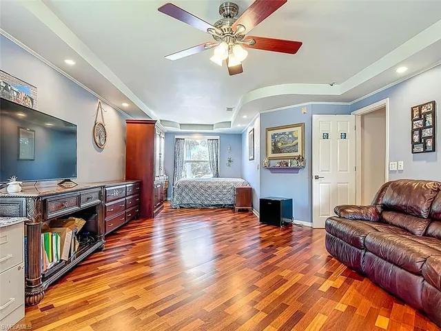 a living room with fireplace furniture and a flat screen tv