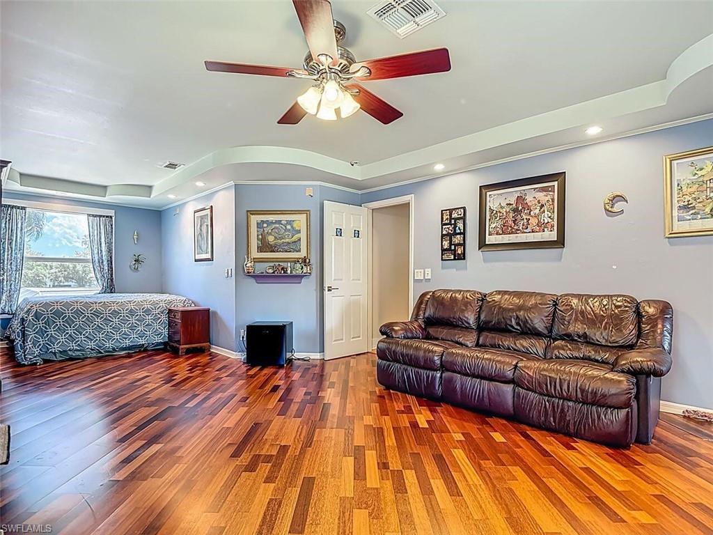 14991 Savannah Drive Naples, FL 34119 - Photo 30 of 50 a living room with furniture and a fireplace