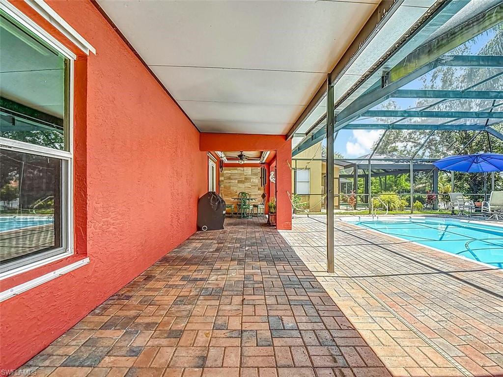 14991 Savannah Drive Naples, FL 34119 - Photo 44 of 50 a view of a building with a porch