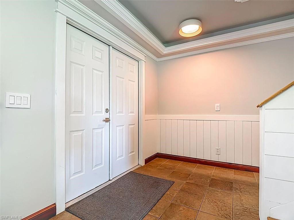 14991 Savannah Drive Naples, FL 34119 - Photo 8 of 50 a view of a room with an empty space and a window