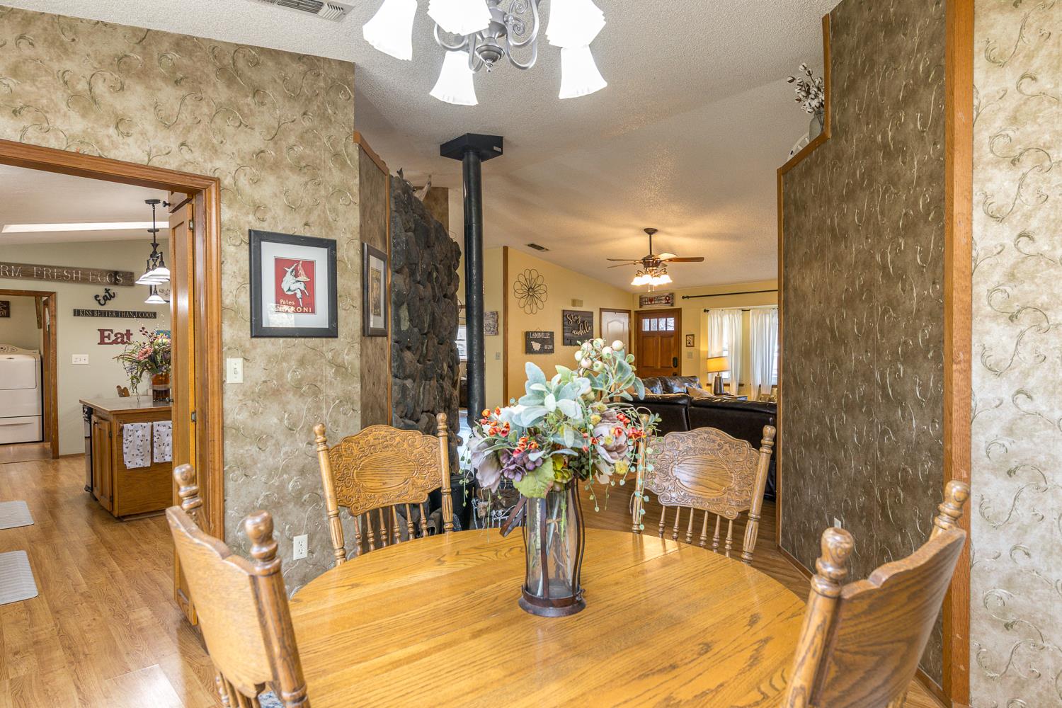 2155 El Faro Way La Grange, CA 95329 - Photo 18 of 52 a living room with furniture and a chandelier