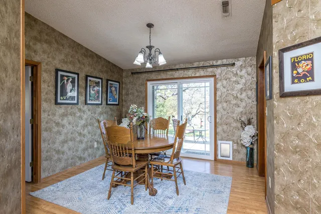a view of a dining room with furniture window and outside view