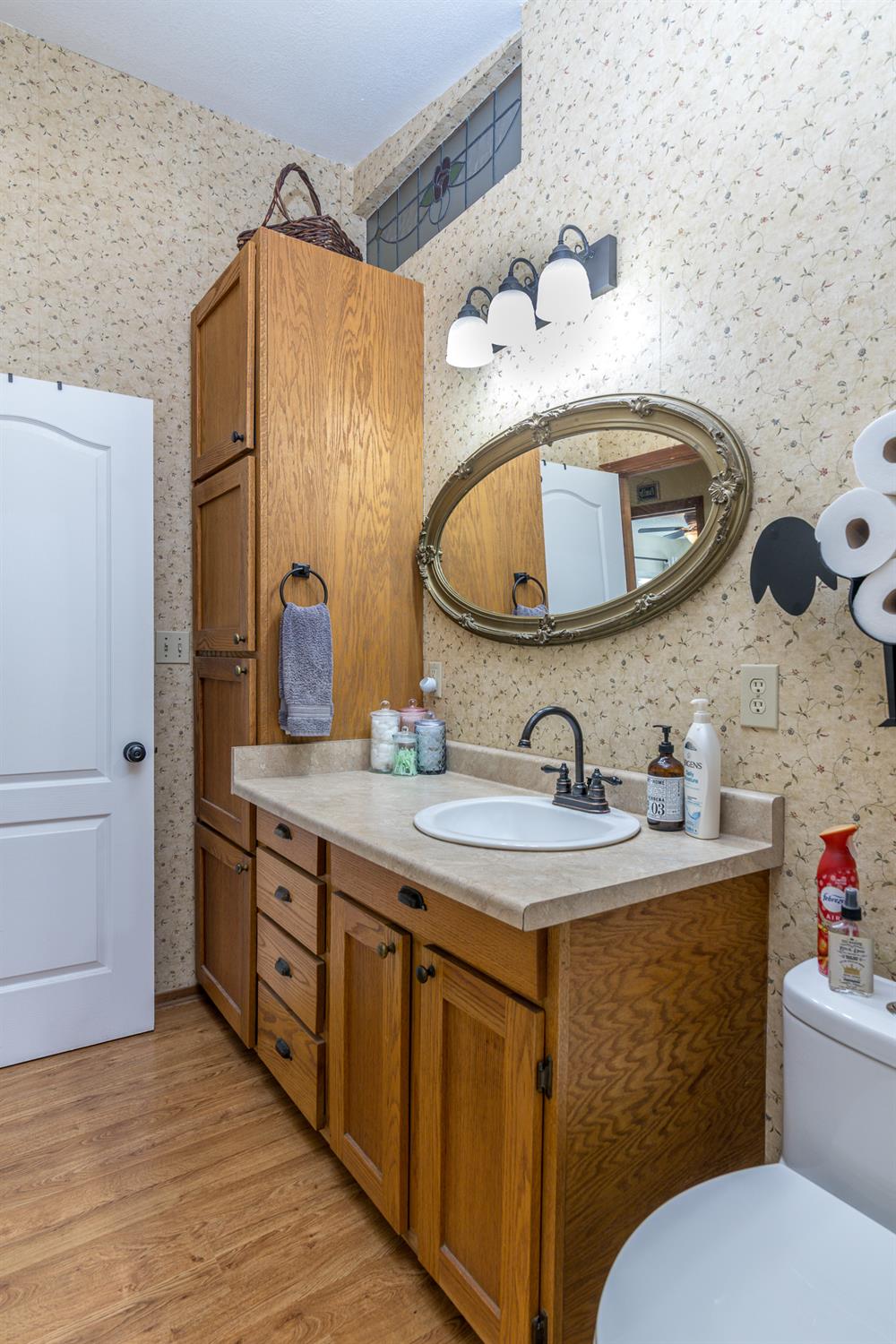 2155 El Faro Way La Grange, CA 95329 - Photo 27 of 52 a bathroom with a granite countertop toilet sink and mirror