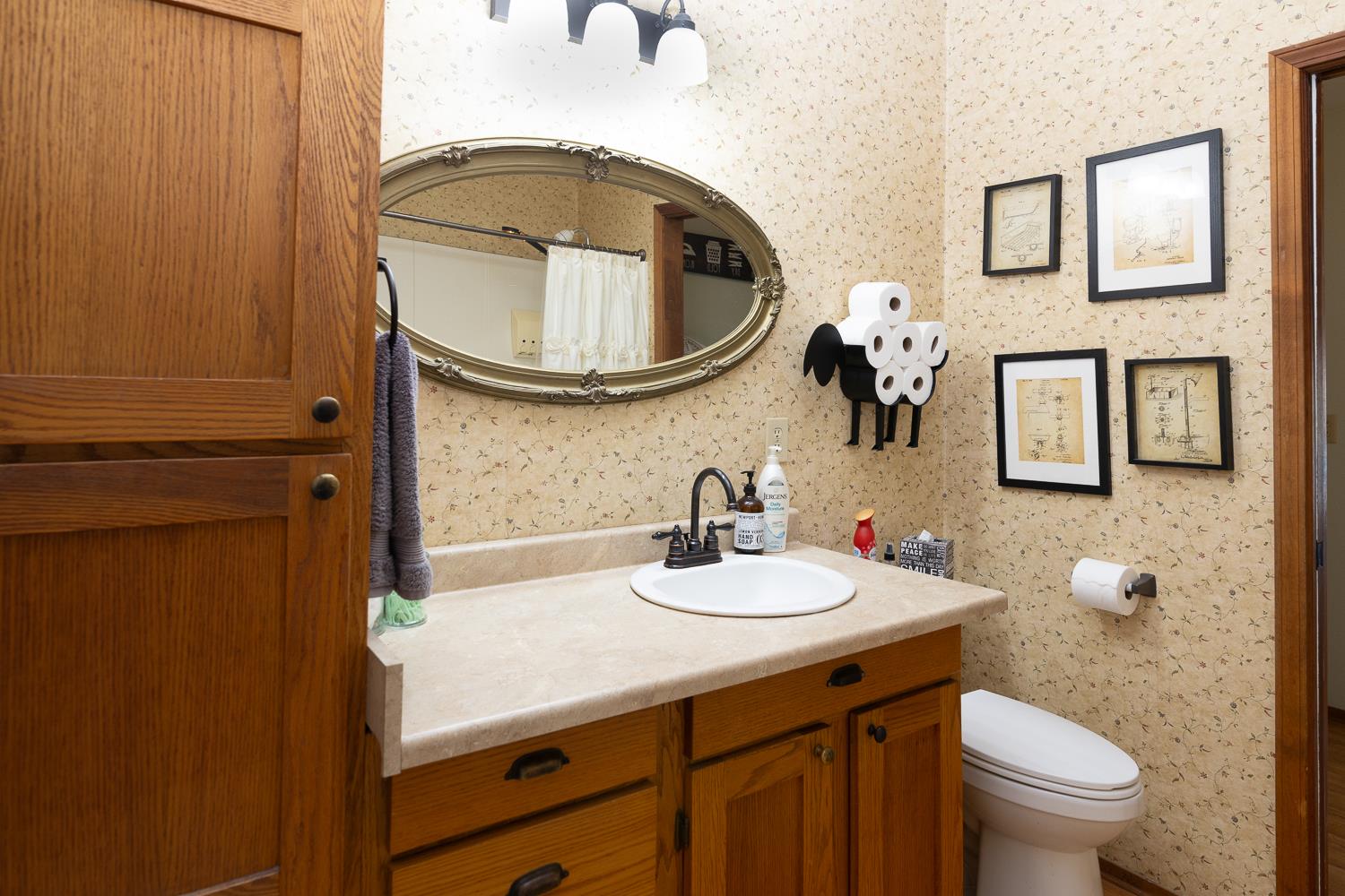 2155 El Faro Way La Grange, CA 95329 - Photo 28 of 52 a bathroom with a sink a toilet and a mirror